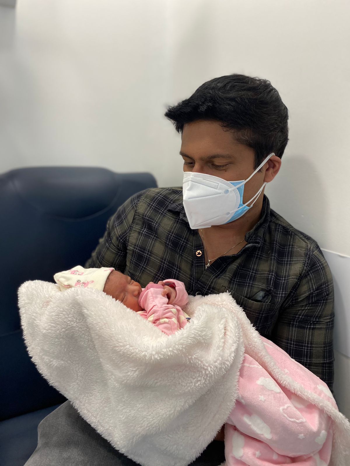 Sumit holding Arianna for the first time