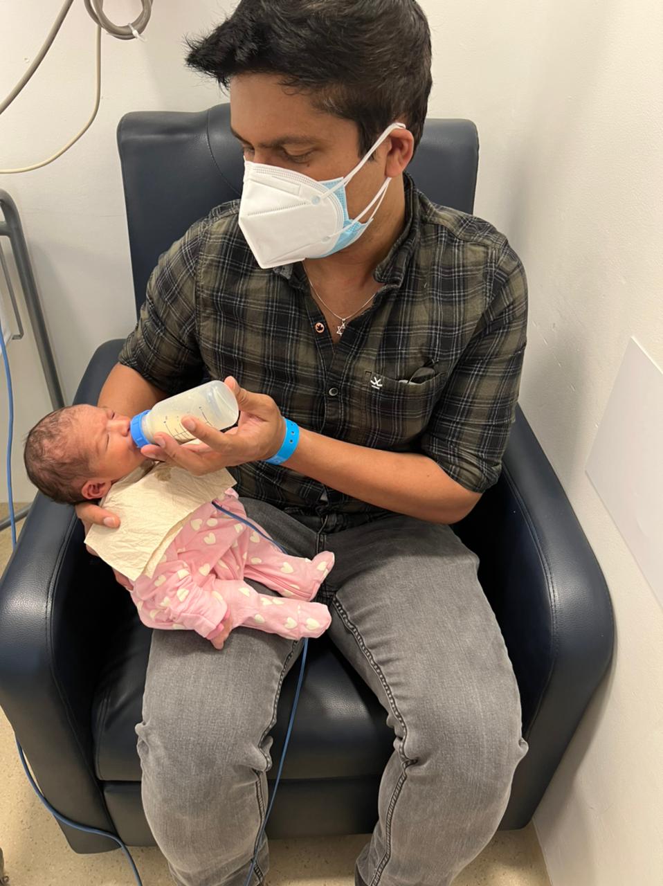 Sumit feeding Arianna for the first time